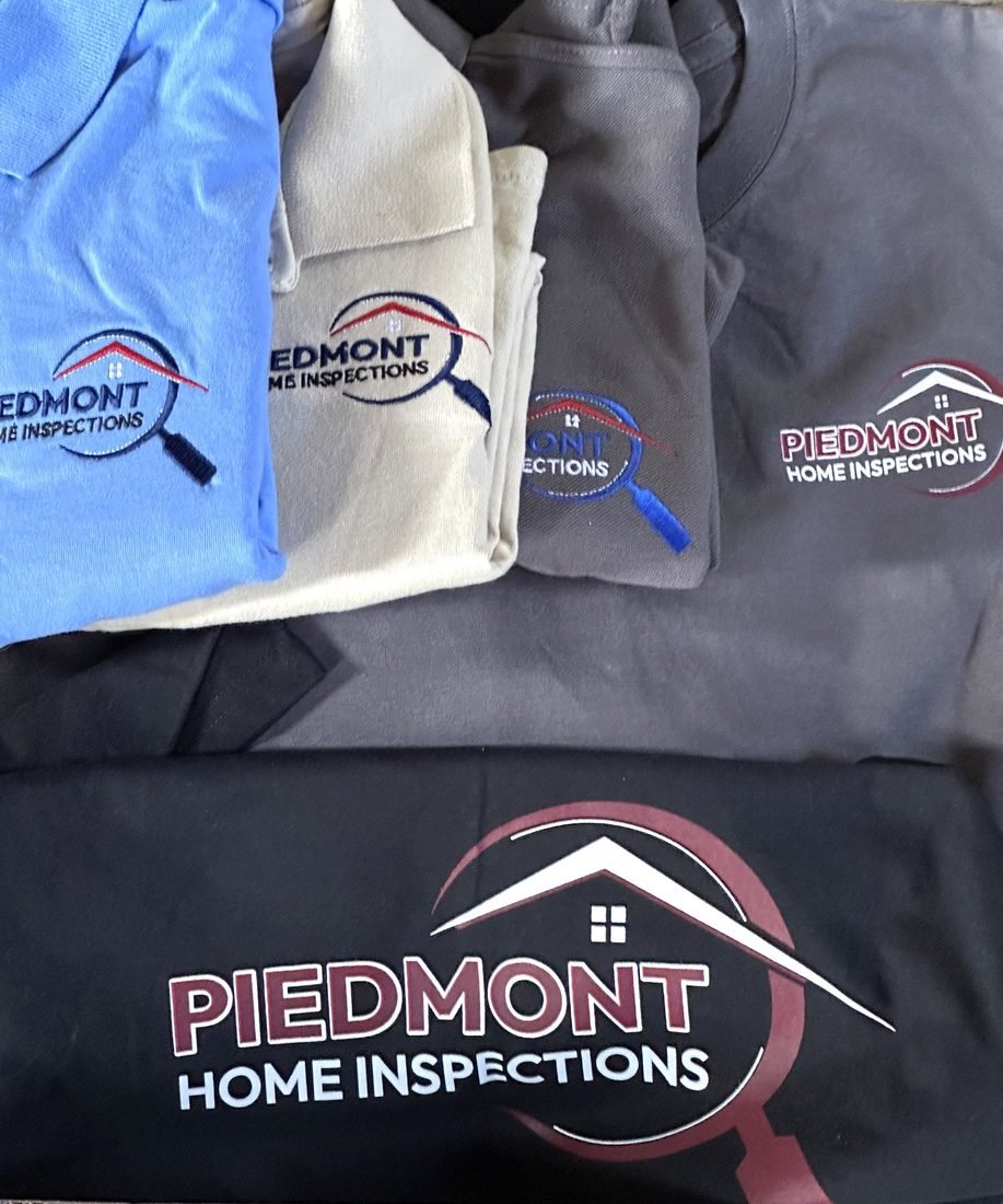 Embroidered company uniform pieces laid out flat